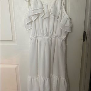 White ruffle dress with tie and tassel straps